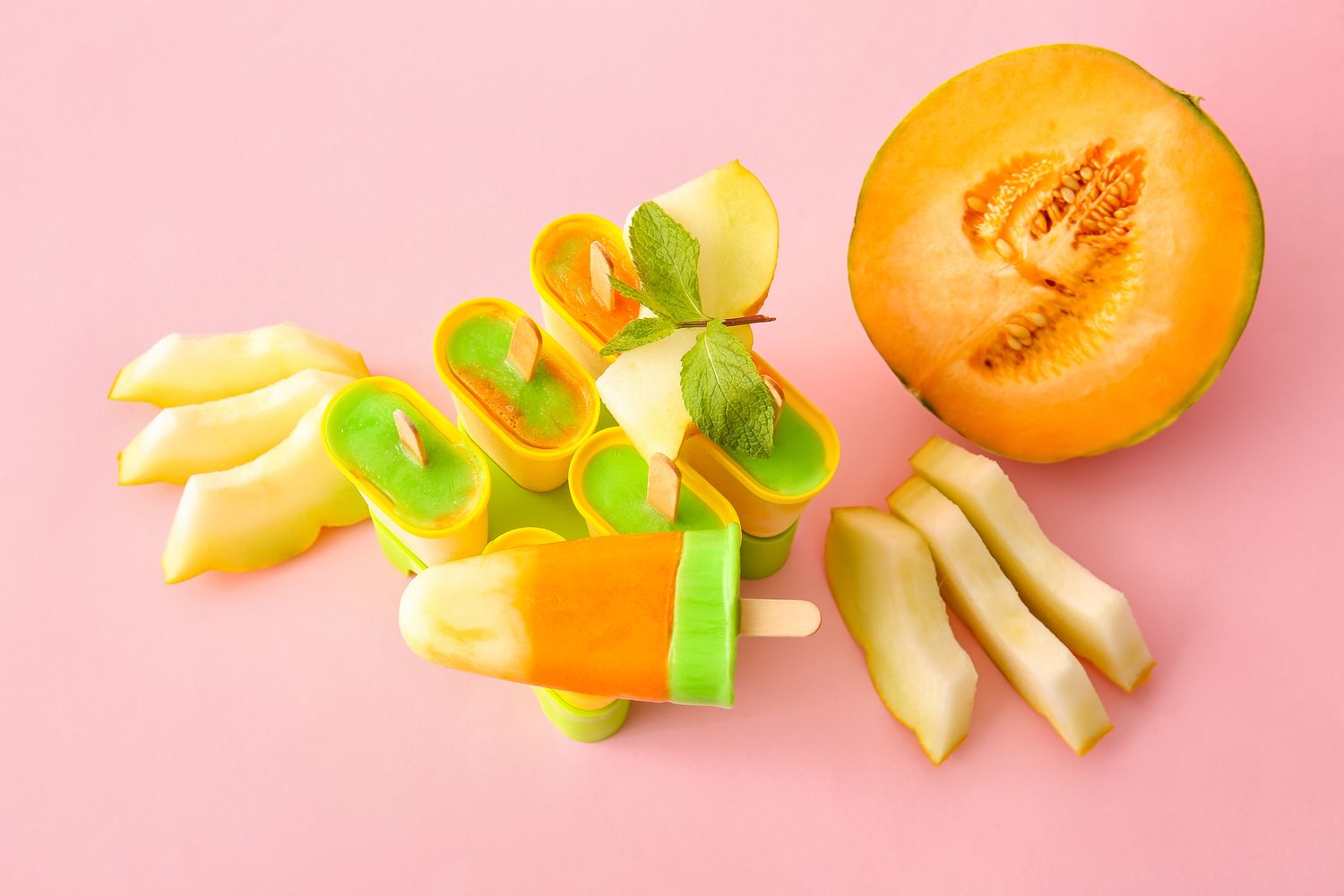 Containers,With,Tasty,Popsicles,And,Melon,Pieces,On,Pink,Background